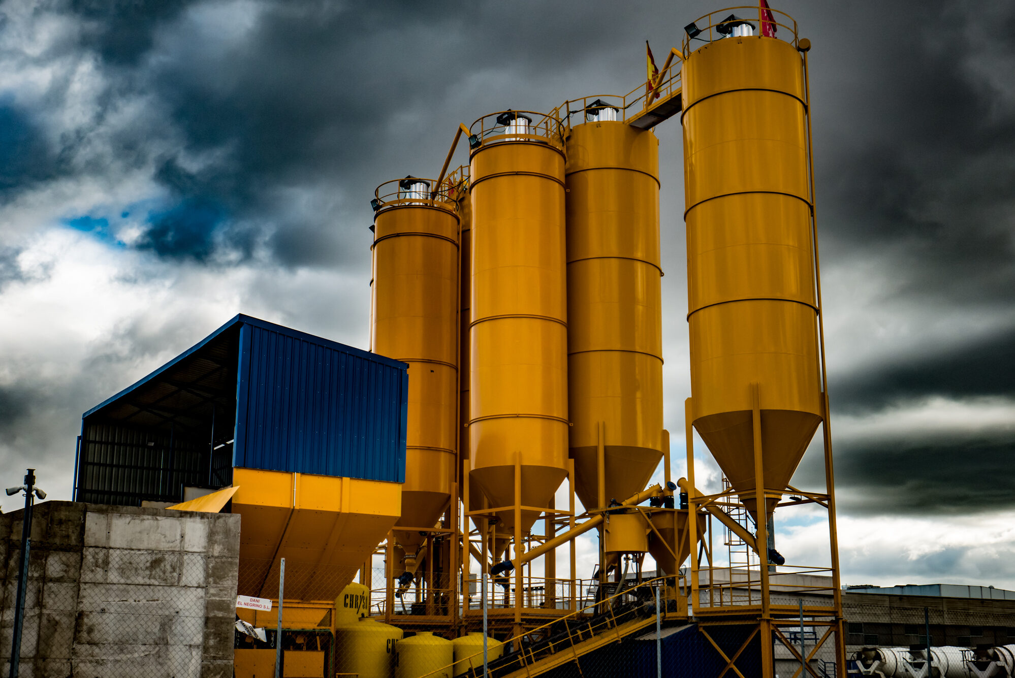Yellow silos in a cement factory