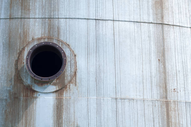 Silver and rusty metal wall with circle hole