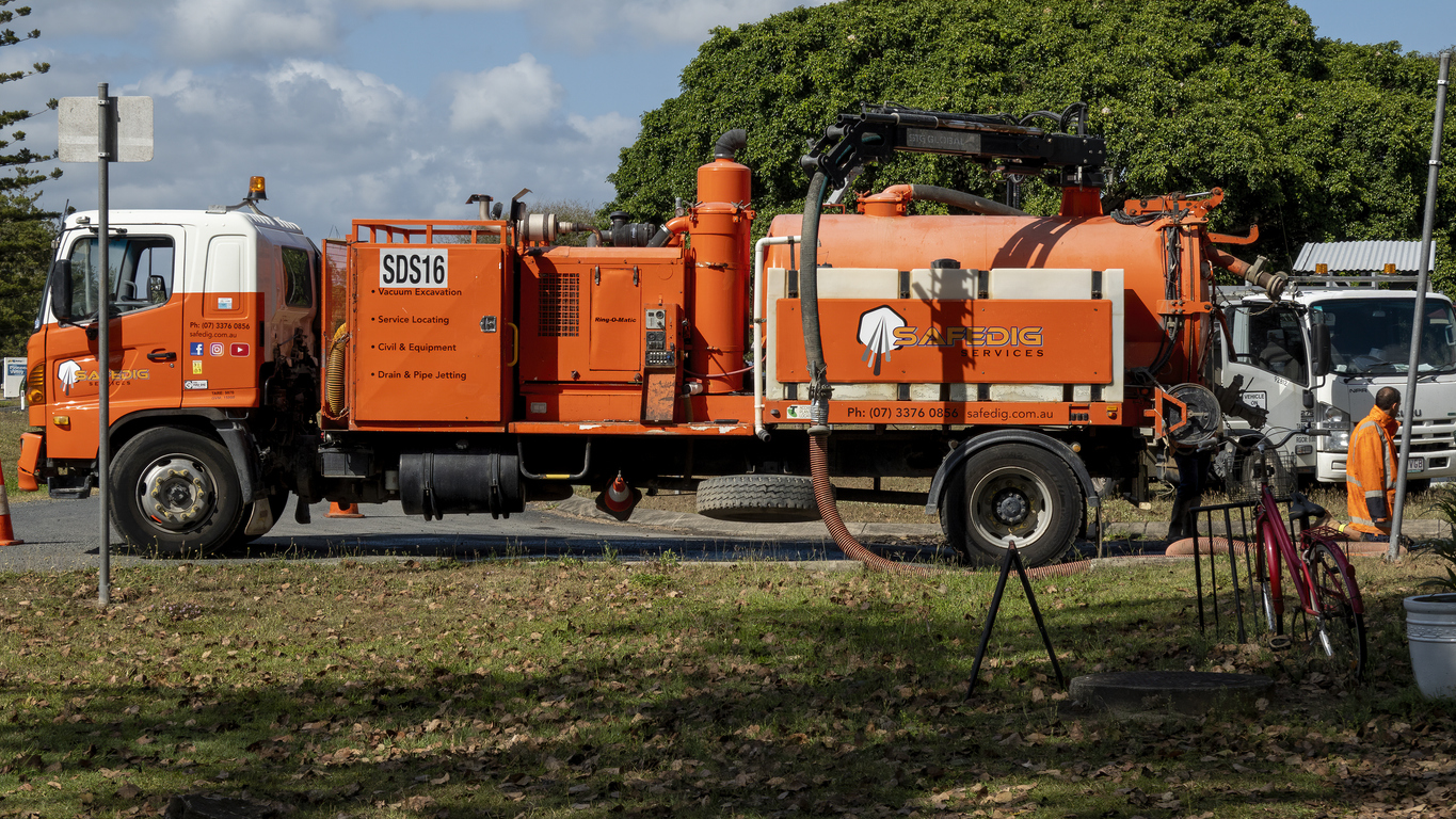 an orange vac truck